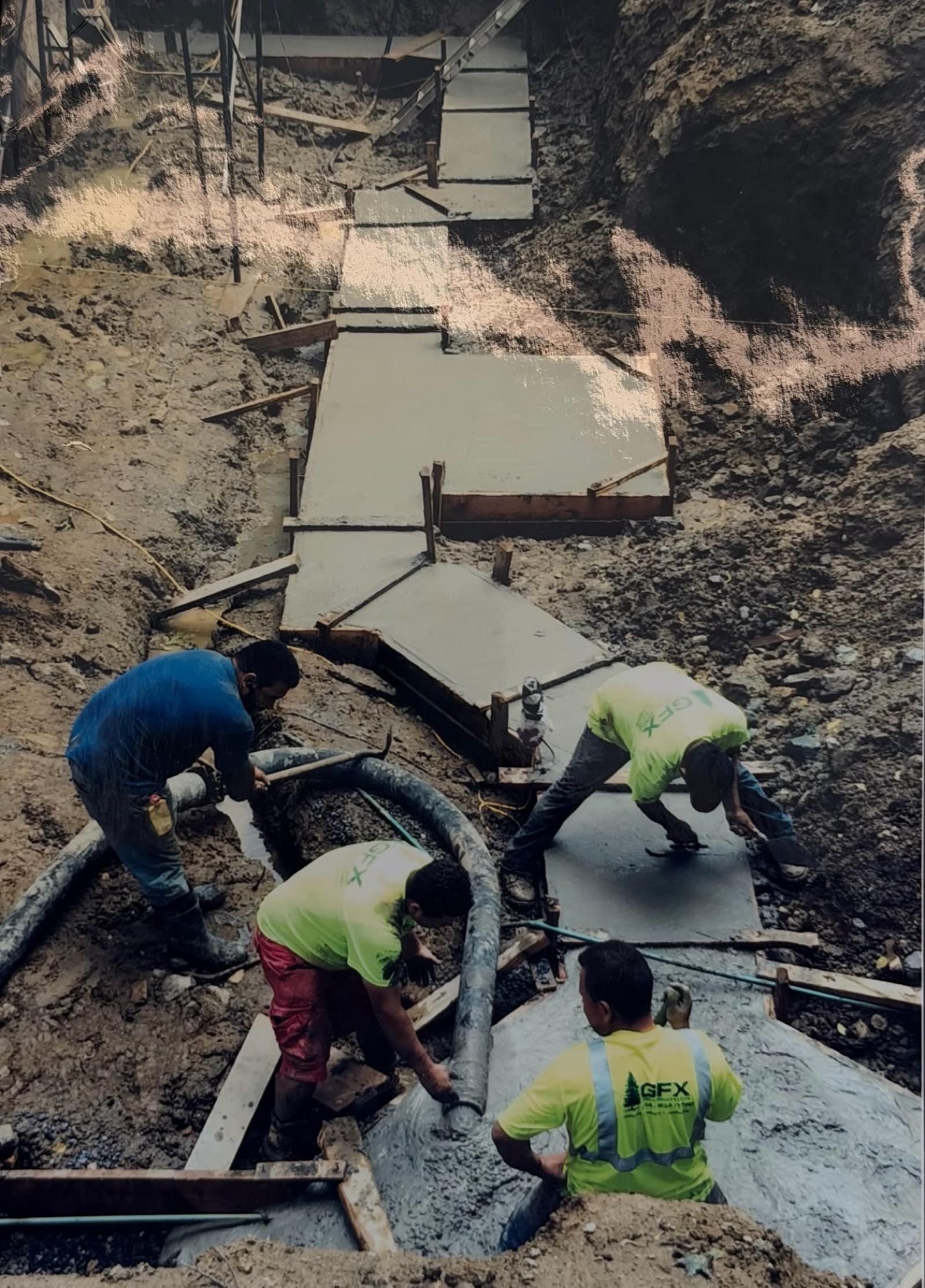 GFX crew pouring concrete in the early days